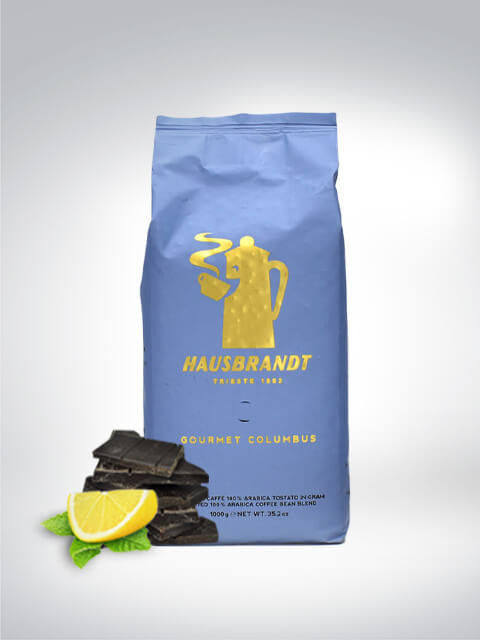 Paquet de café Hausbrandt Gourmet Columbus décoré avec du citron et du chocolat